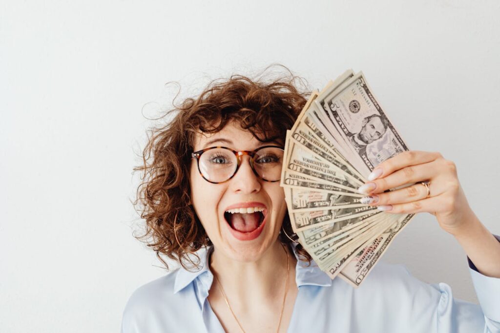 woman happy with money savings
